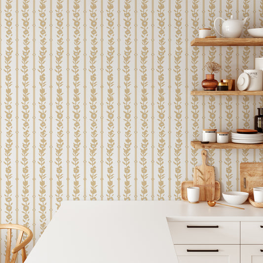 Kitchen wall featuring our oversized floral and stripe Esme peel and stick wallpaper in light yellow, grey, and cream by Jackie O'Bosky.