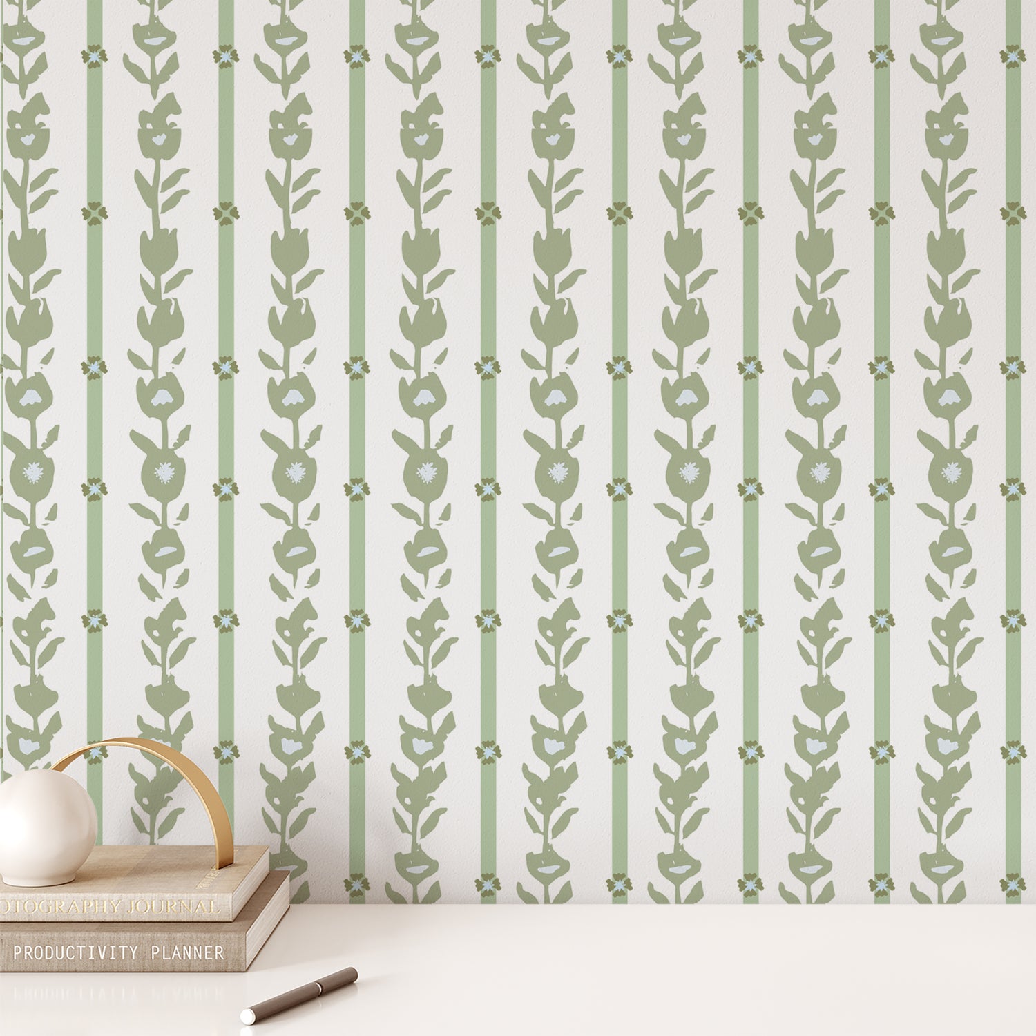 Office wall featuring our oversized floral and stripe Esme peel and stick wallpaper in green, blue, and white by Jackie O'Bosky.