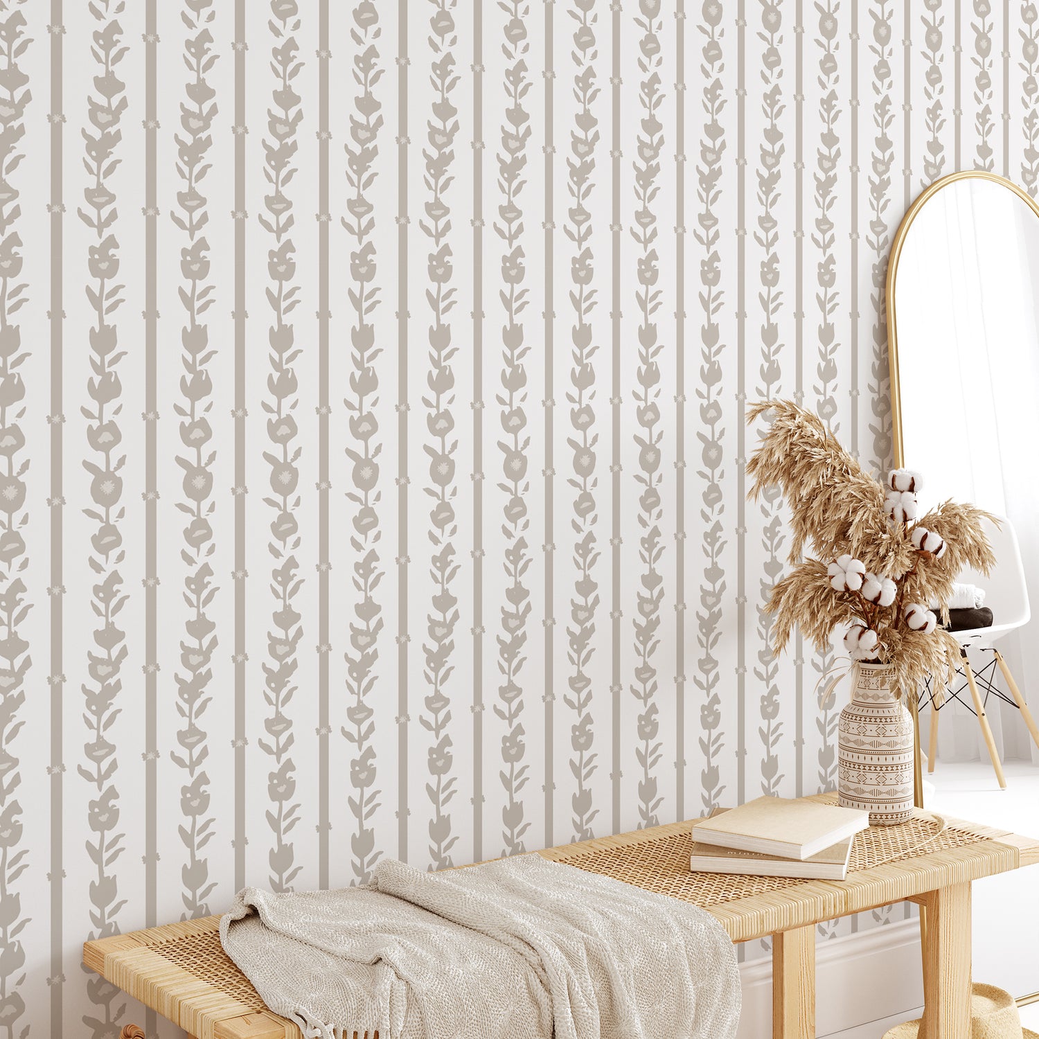 Bedroom wall featuring our oversized floral and stripe Esme peel and stick wallpaper in sand, tan, white by Jackie O'Bosky.