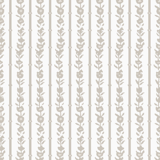 Close up of our oversized floral and stripe Esme peel and stick wallpaper in sand, tan, white by Jackie O'Bosky.
