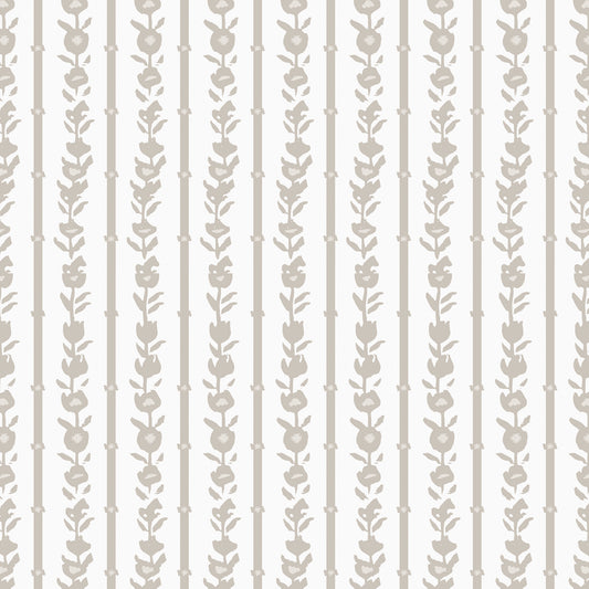 Close up of our oversized floral and stripe Esme peel and stick wallpaper in sand, tan, white by Jackie O'Bosky.