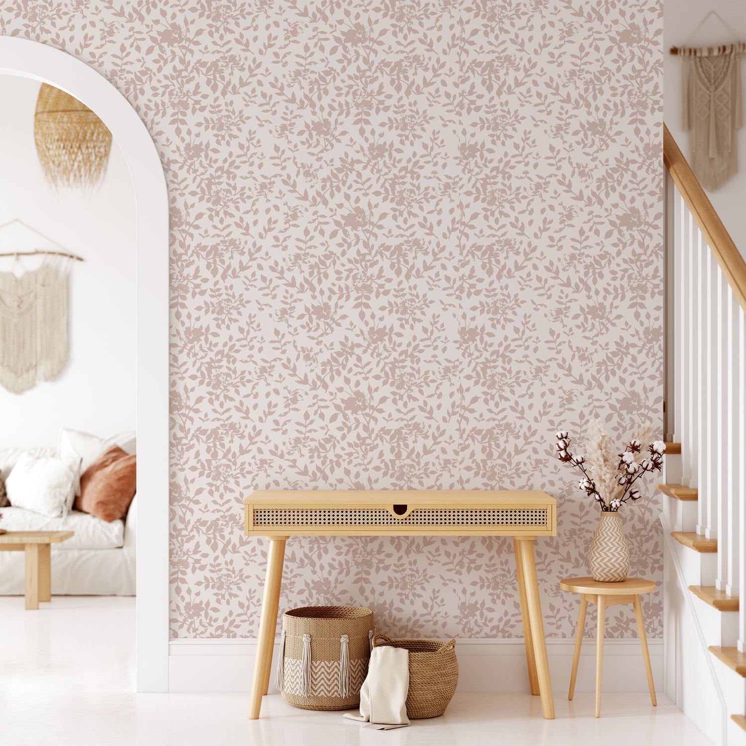 Living room wall featuring our floral Florence peel and stick wallpaper in pink, taupe nude on a white background. This organic floral has a painted feel and makes the perfect accent wall!