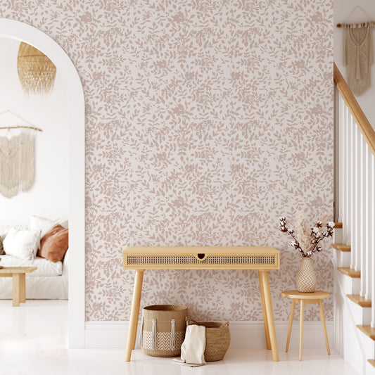 Living room wall featuring our floral Florence peel and stick wallpaper in pink, taupe nude on a white background. This organic floral has a painted feel and makes the perfect accent wall!
